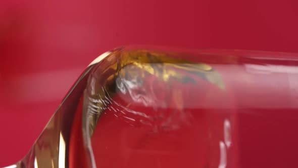 Vertical video, Close-up: red wine is poured into a glass