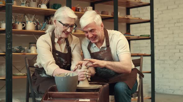 Seniors Woman and Man are Engaged in Pottery