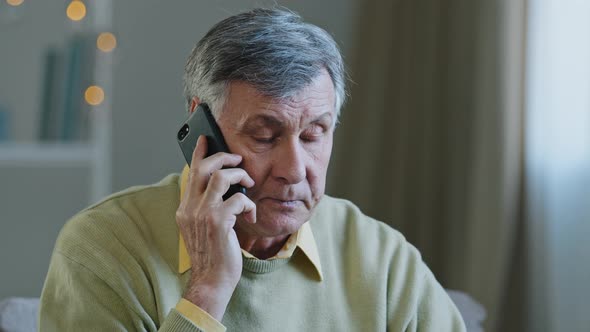 Stressed Old Man Worried Caucasian Senior Mature Grandfather Hearing Awful News at Mobile Phone Call