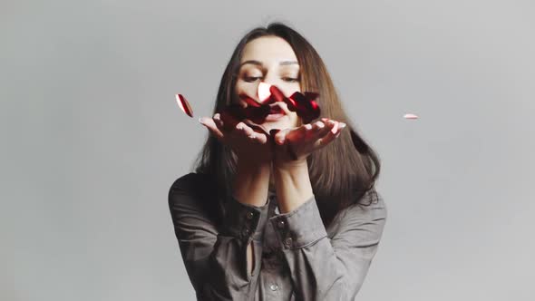 Woman Blowing Confetti