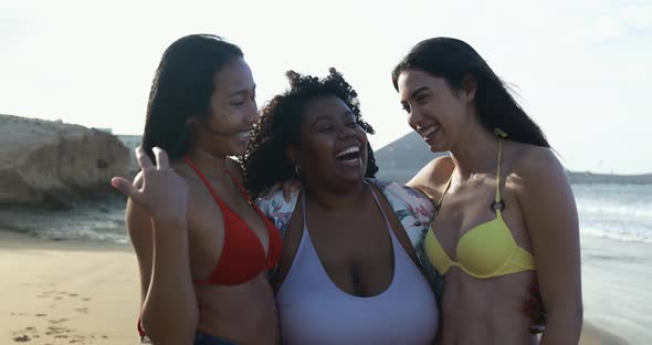 Multiracial women having fun on the beach - Girls with different bodies and skins laughing together