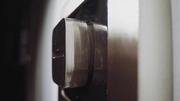 Man Puts Small Coin Into Split of Lock to Open Slammed Door