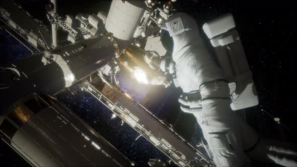 Astronaut Outside the International Space Station on a Spacewalk alt