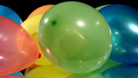 Multicolored Different Balloons, Rotation, on Black Background