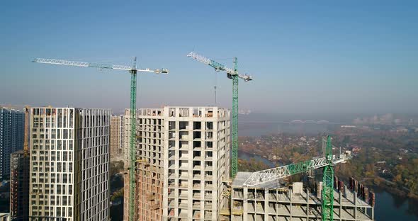 Landscape in the City with Under Construction Buildings and Industrial Cranes