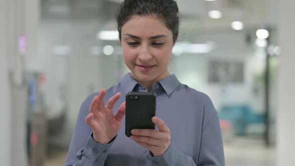 Portrait of Young Indian Woman Using Smartphone