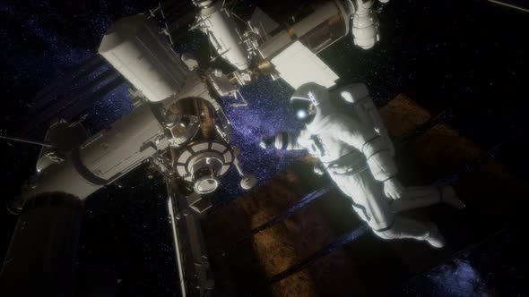 Astronaut Outside the International Space Station on a Spacewalk alt