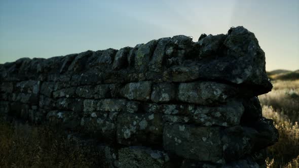 Scottish Land Border Stone Wall at Sunset