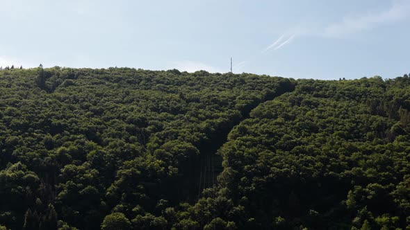 Static time lapse of few clouds flying by over a lush hillside of the Moselle region in west Germany