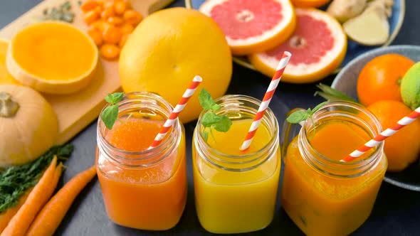 Close Up of Fresh Juices in Mason Jar Glasses 