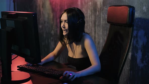 Serious Woman Enjoys Victory in a Video Game