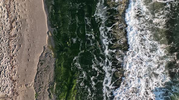 Texture of the rocky beach aerial view 4 K Turkey Alanya