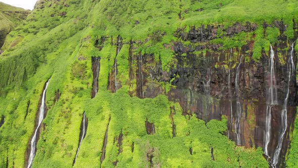 Waterfalls Flowing Down Mountains in Poco Ribeira Do Ferreiro Flores Island