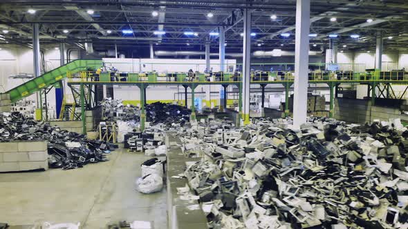 Big Recycling Center with Piles of Trash. Trash, E-waste, Electronic Garbage Recycling Factory