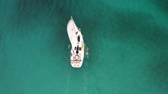 Sailboat Traveling On Calm Ocean In The Bahamas At Summer. aerial