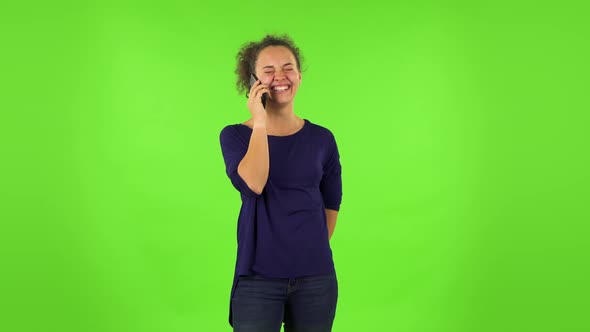 Curly Woman Smiling, Talking for Mobile Phone and Rejoice . Green Screen