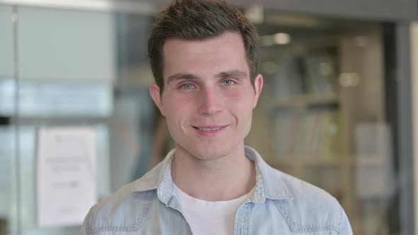 Portrait of Cheerful Young Designer Smiling at Camera