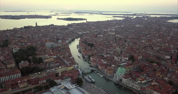 Wide aerial shot of Venice and Chiesa di San Simeone Piccolo from above at dusk