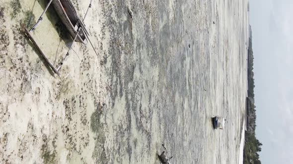 Vertical Video Boats in the Ocean Near the Coast of Zanzibar Tanzania Aerial View