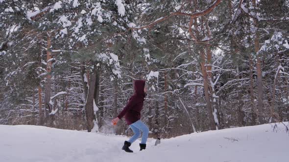 Slow Motion Woman Throwing Hot Water in Cold Air Warm Water Turning to Steam