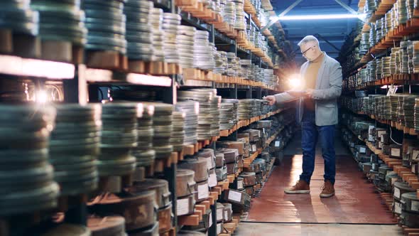 Archive Employee is Keeping Track of Old Film Tapes