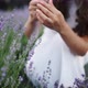 Beautiful Girl Collects Lavender Flowers and Puts Them in a Basket on a Lavender Grove Closeup - VideoHive Item for Sale