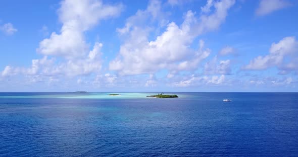 Natural birds eye copy space shot of a white sand paradise beach and blue sea background