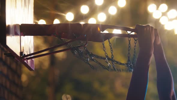 Basketball Ball Getting in the Hoop on Playground at Night - Slam Dunk