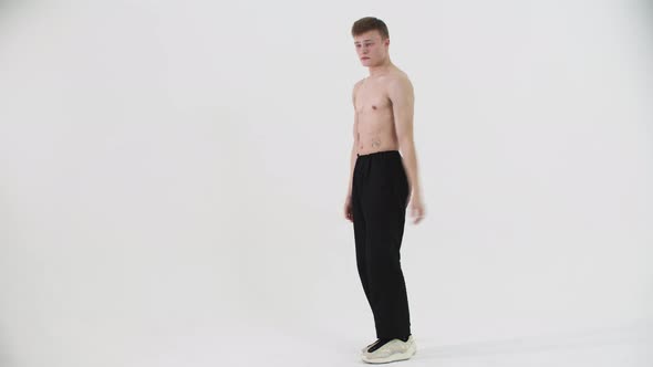 Dancing Popping  Young Shirtless Man Freestyle Dancing on Cyclorama