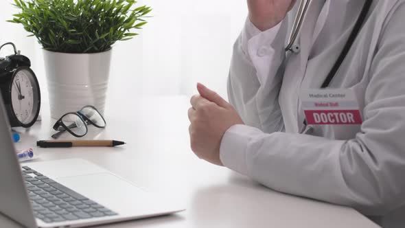 Female Doctor Therapist Practitioner Using Mobile Smartphone in Clinic Office