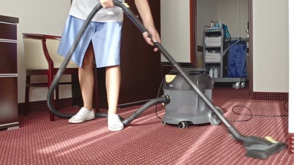 Cleaning Lady Vacuuming Room