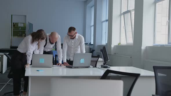 Coworkers Do Business and Watch on the Laptops