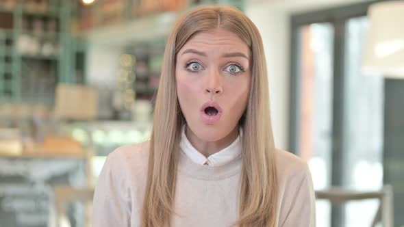 Portrait of Excited Young Woman Celebrating Success