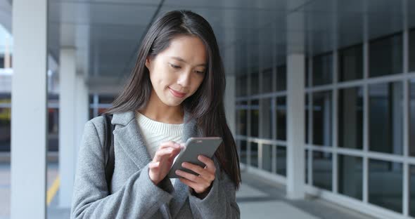 Business woman using smart phone at outdoor