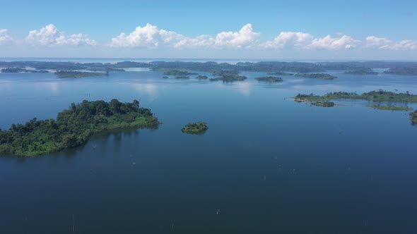 Drone Shows A Vast Blue Lake, Dam With Islands Full Of Green Trees, Paradise In Brazil
