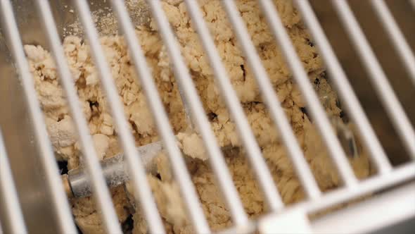 Man Using Pasta Machine to Prepare Dough for Tagliatelle Close Up View Modern Pasta Machine Kneaders