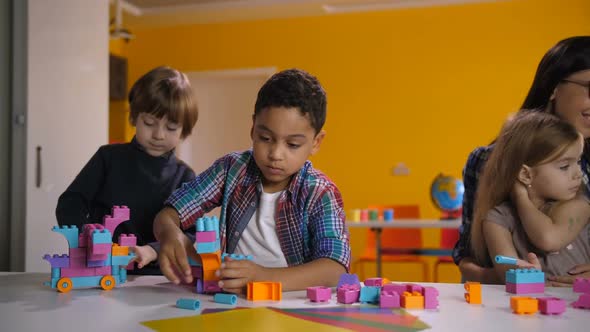 Children Building with Bright Constructing Bricks