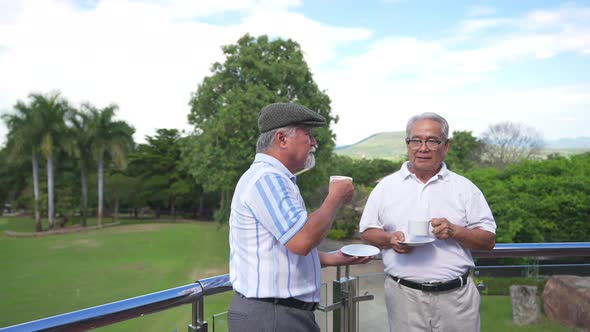 4K Asian senior man friends drinking coffee with talking together at golf country club terrace.