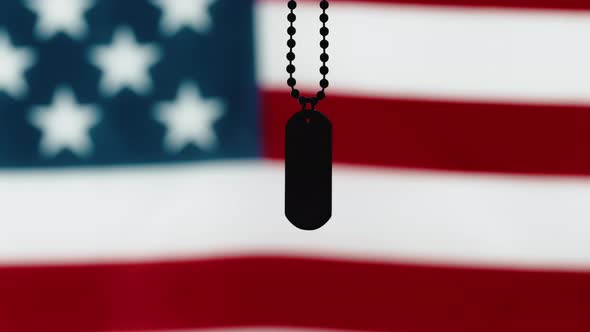 Military Tag with the Flag of the United States of American Out of Focus