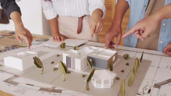 Team of Architects Discussing Housing Project