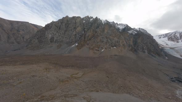 Aerial View Flying Amazing Natural Rocky Terrain Valley with River Melting Glacier Huge Mountain