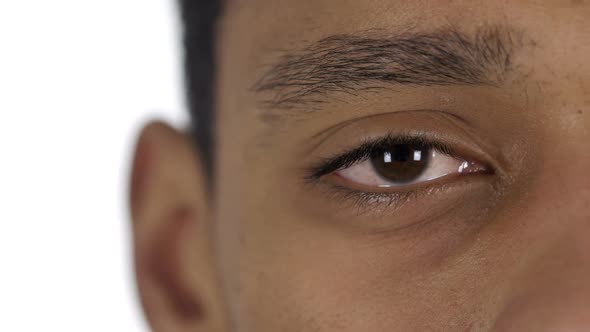 Close Up of Blinking One Eye of AfroAmerican Man