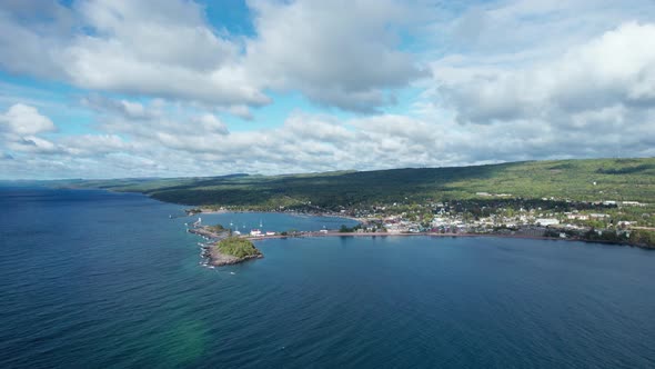 High elevation drone view of a boat harbor on a beautiful summer day