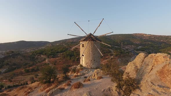 Old Traditional Historic Stone Windmill at the Sunset