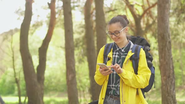 Young female tourist search position navigation on smart phone to find right way