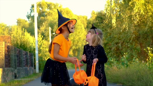 Children in Costumes are Celebrating Halloween