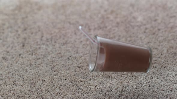 Glass of chocolate milk spilling on carpet in slow motion; shot on Phantom Flex 4K at 1000 fps