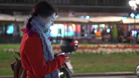 Portrait of Young Girl Walking Around the City with Smartphone