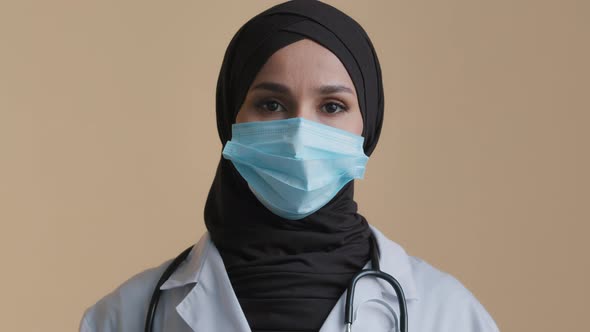 Portrait of Arabian Muslim Woman Nurse Doctor Wear Hijab Protective Medical Mask Posing with