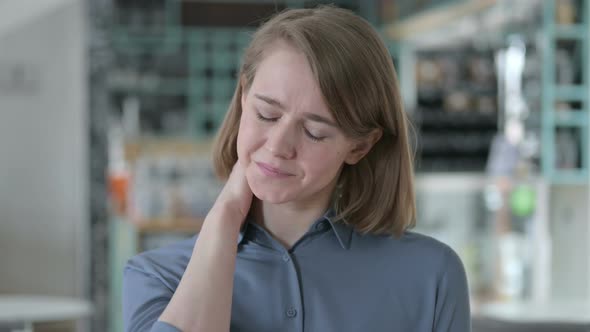 Portrait of Young Woman Having Neck Pain